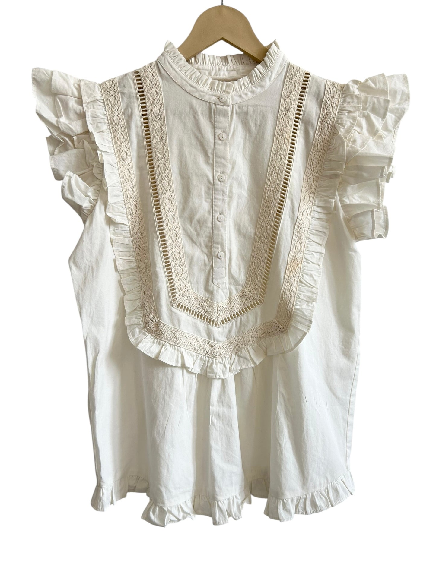 White sleeveless ruffle top