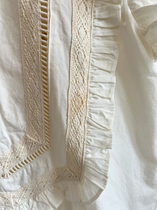 White sleeveless ruffle top
