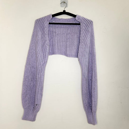 Light purple cardigan and top set on a hanger against a white background